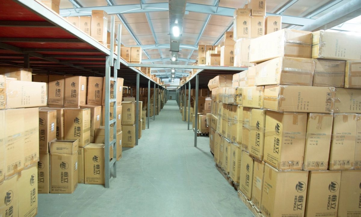 Packaged cartons stacked in a distribution warehouse