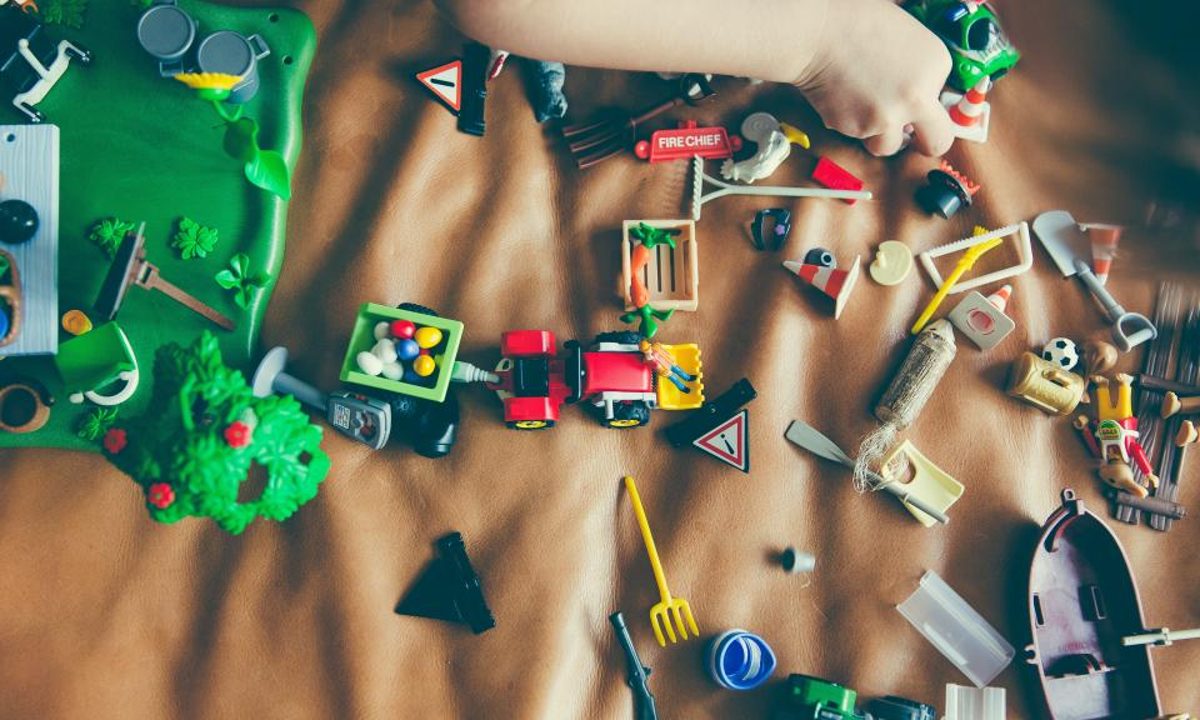 Assorted children's toys arranged on a surface