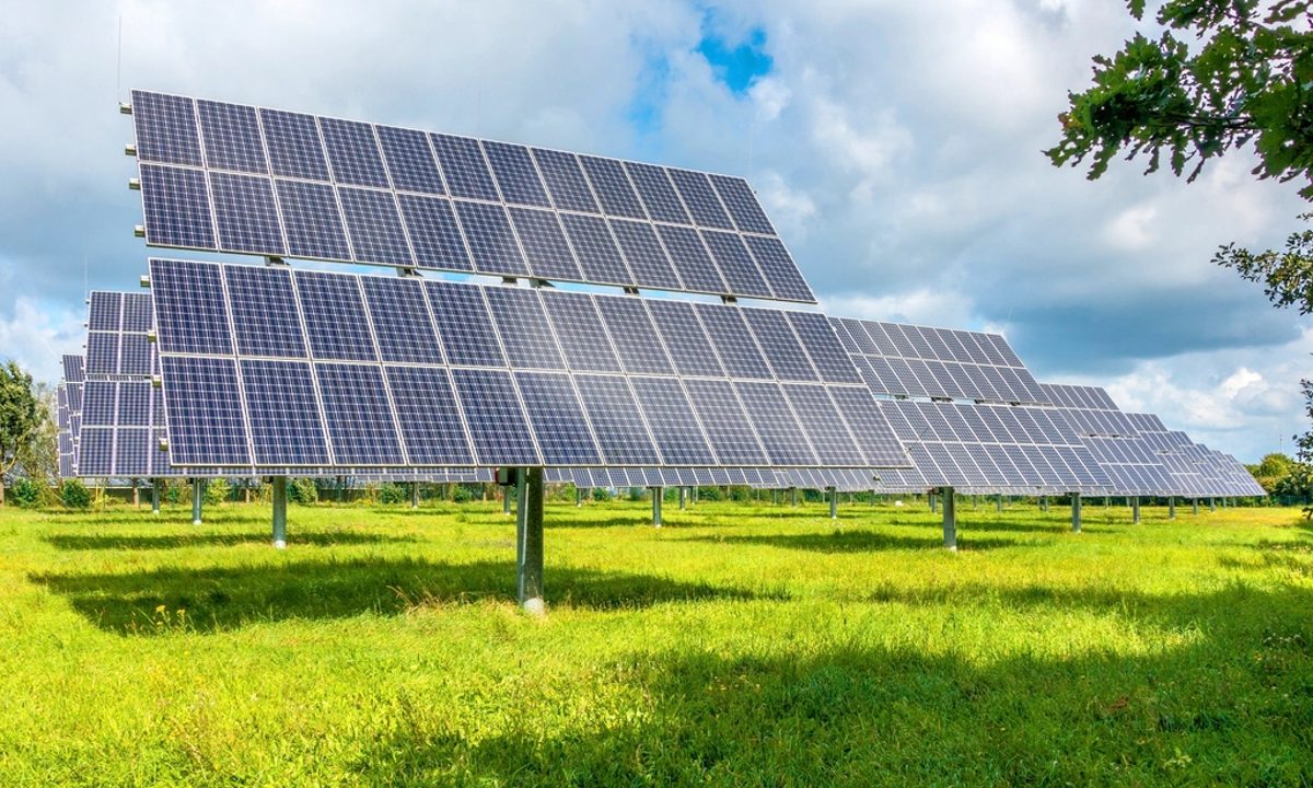 Solar panel array in an open green field