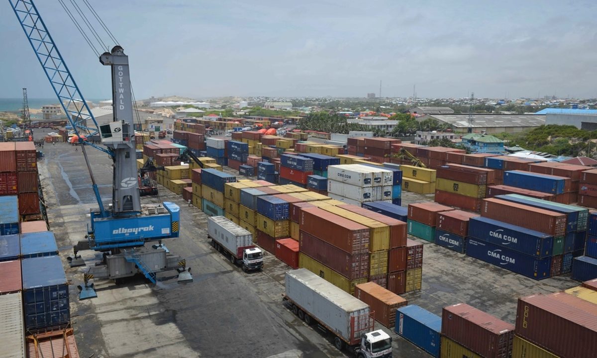 Shipping containers stacked at an industrial port terminal